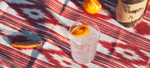 Gin Tonic mit Orangenscheibe mit Gin Eva Flasche